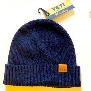 YETI navy blue knit beanie.  Super soft yarn, leather label sewn on one side.